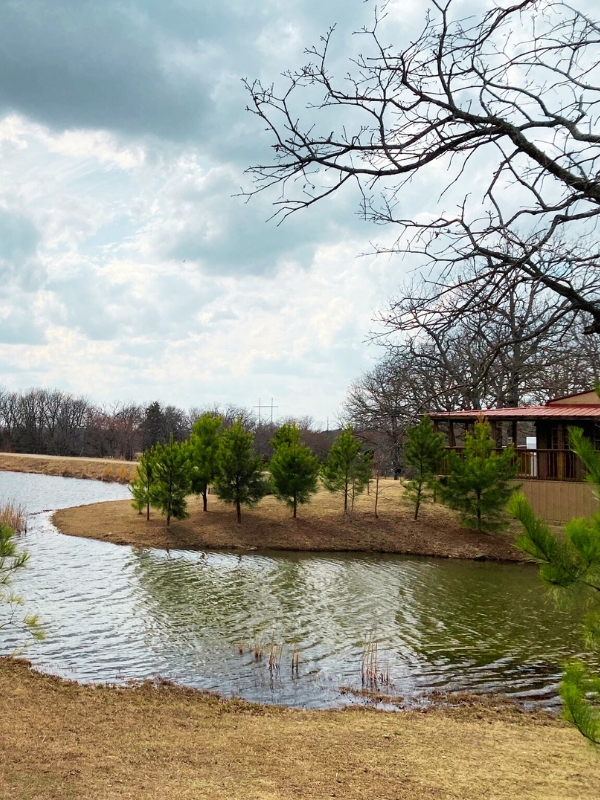 cabin with large porch overlooking stream